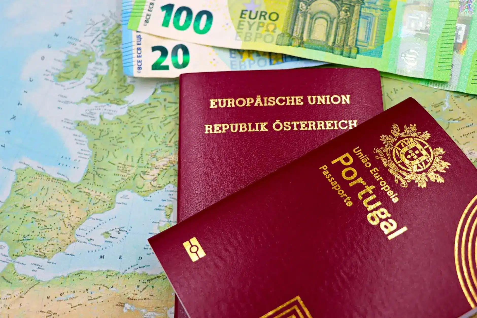 A map showing Europe with a Portuguese passport and Euro banknotes on top.