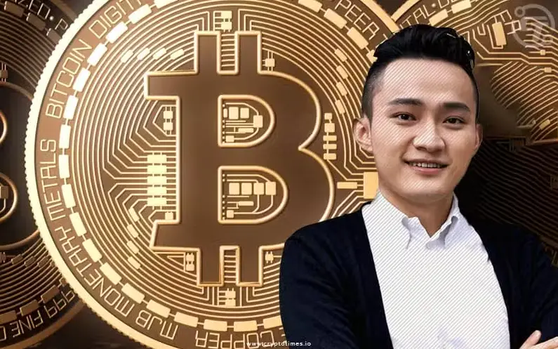 Justin Sun stands in front of a large Bitcoin symbol against a digital backdrop.