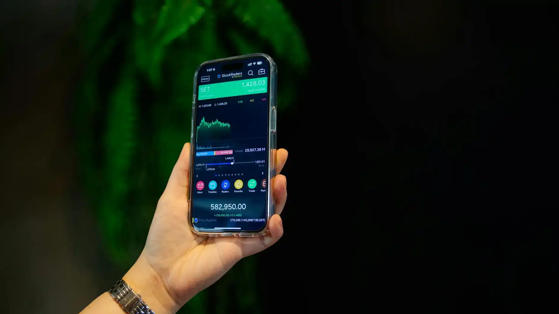 A smartphone displaying a cryptocurrency trading app dashboard with market data.