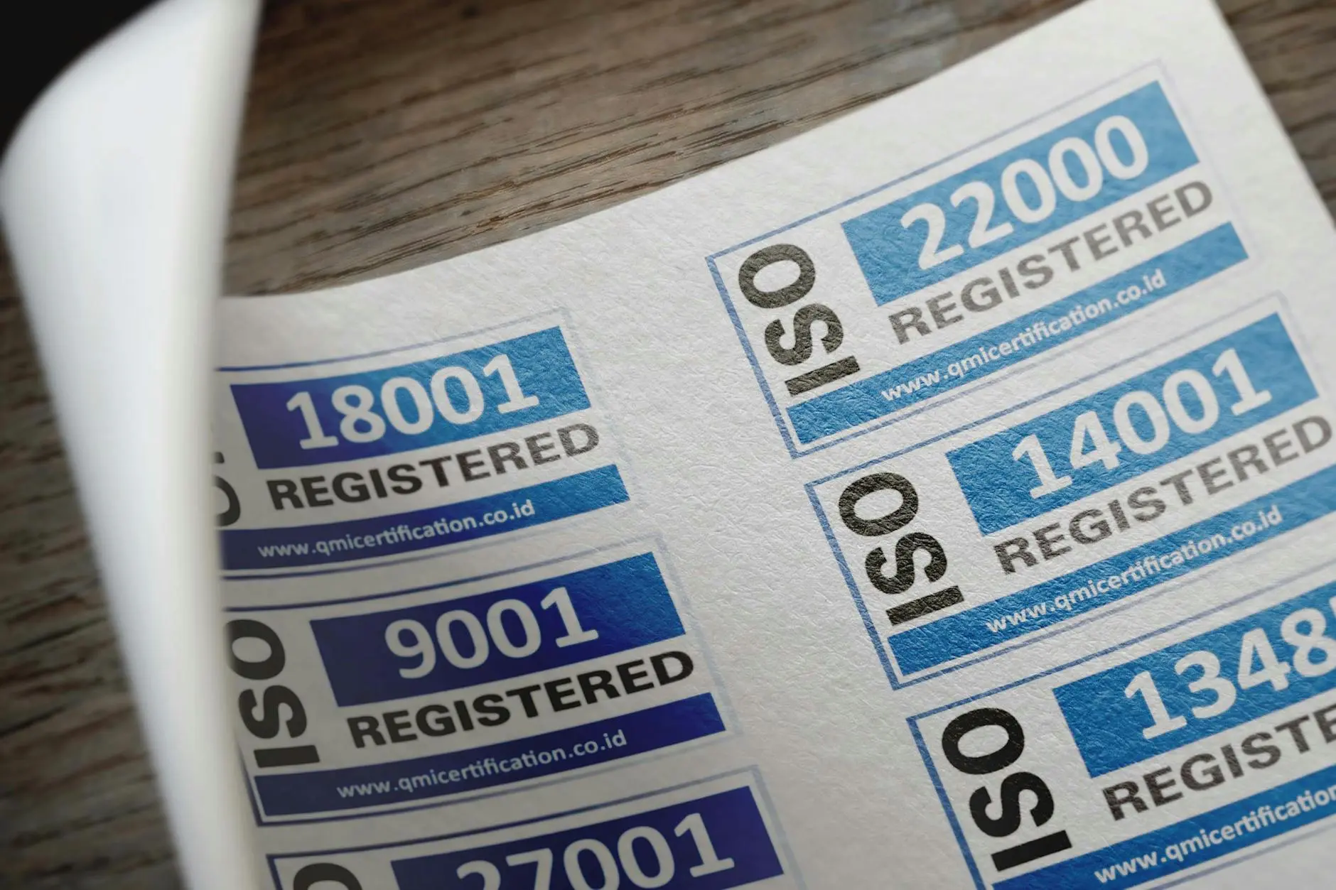 ISO certification labels showing numbers: 18001, 22000, 9001, 14001, 27001, 13485.