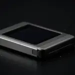 Hardware cryptocurrency wallet on dark surface with security warning light effects