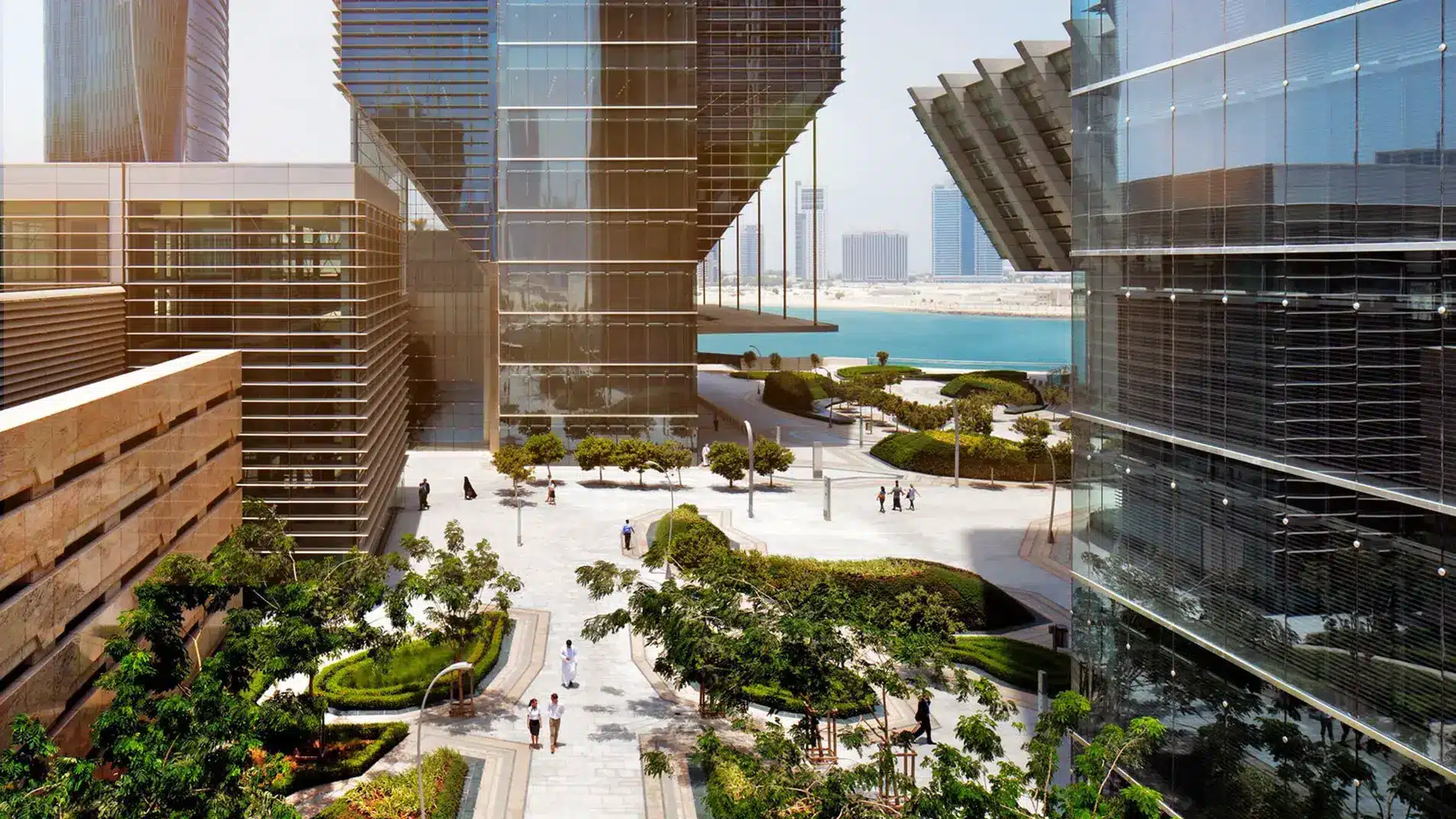 Modern glass skyscrapers and landscaped courtyards at the Abu Dhabi Global Market