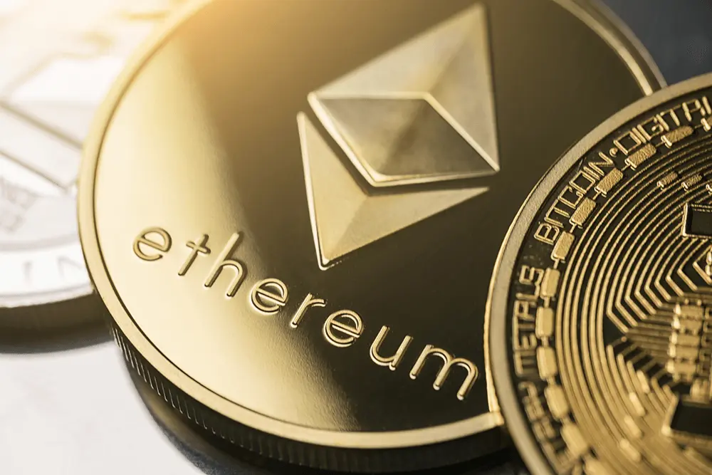 Close-up of gold-colored physical Ethereum and Bitcoin tokens