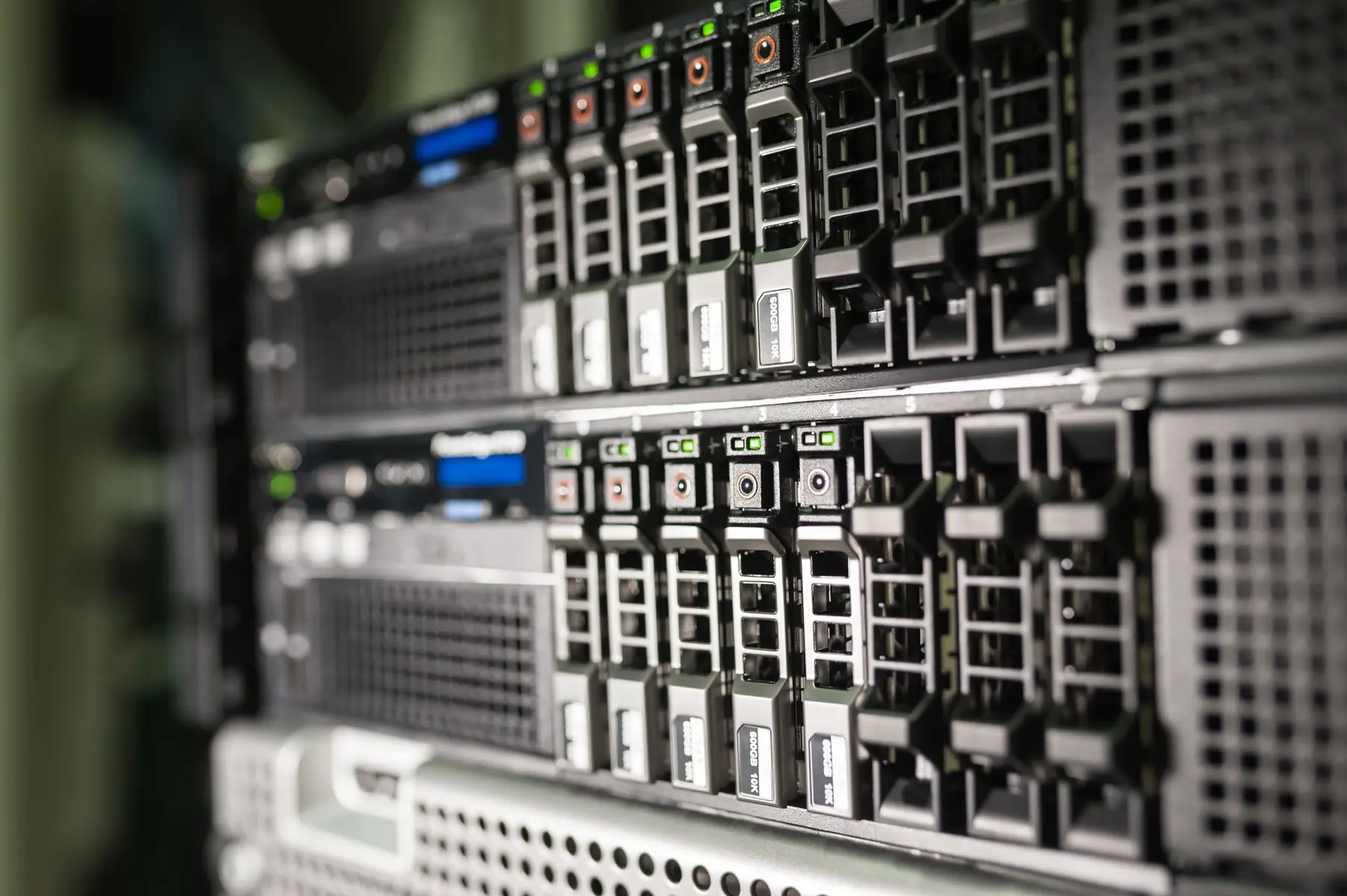 Close-up of rack-mounted enterprise servers with multiple hard drive bays and indicator lights