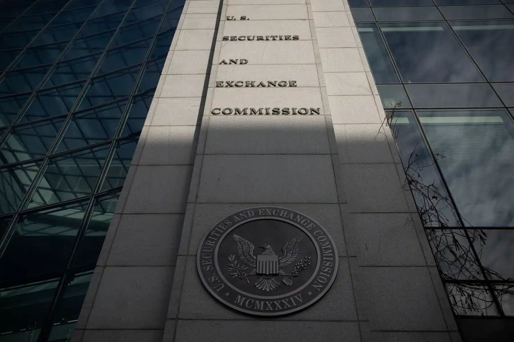 The U.S. Securities and Exchange Commission building facade featuring the official agency name and seal.