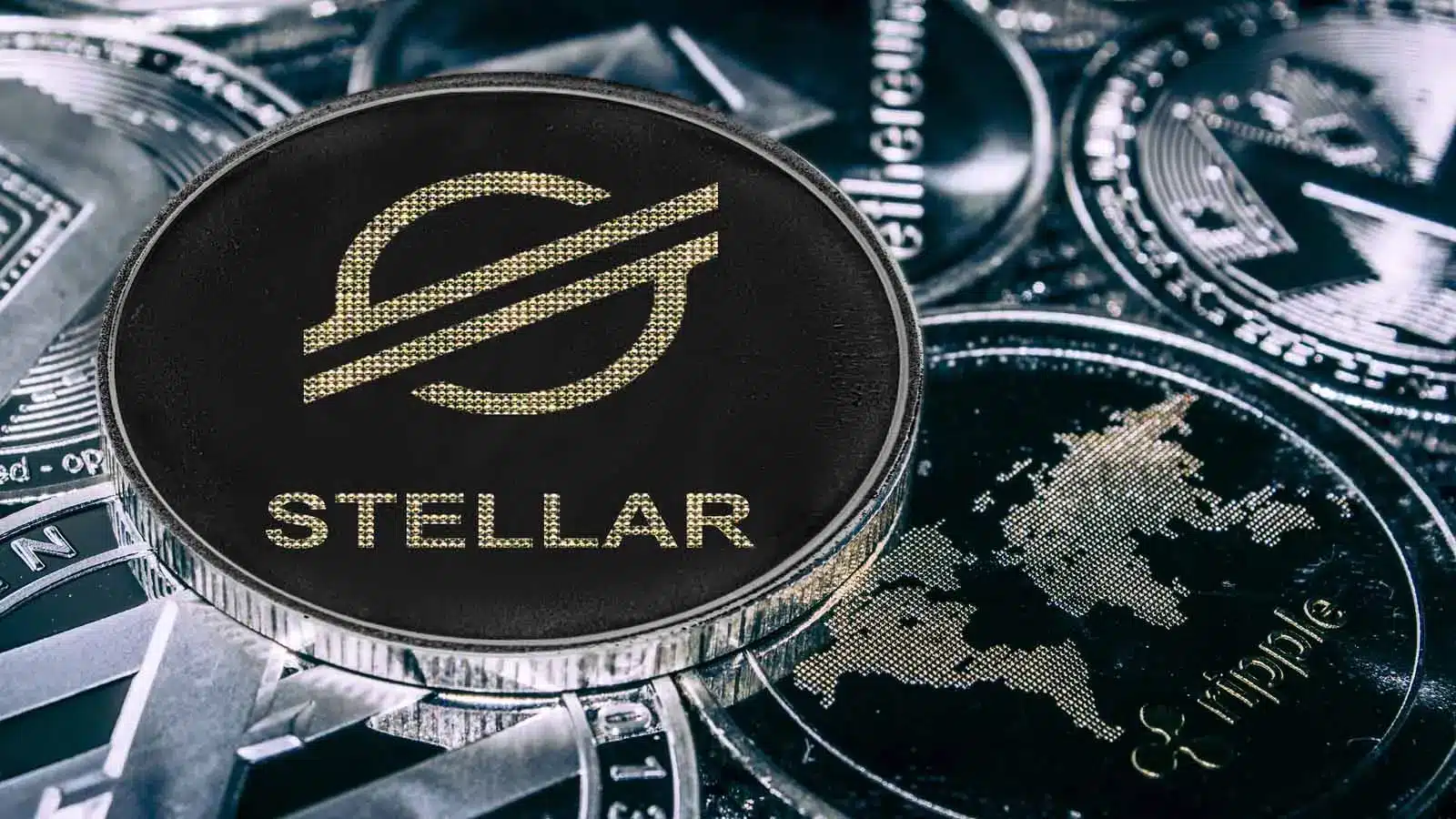A physical Stellar cryptocurrency coin with its logo and name, resting atop other digital currency tokens.