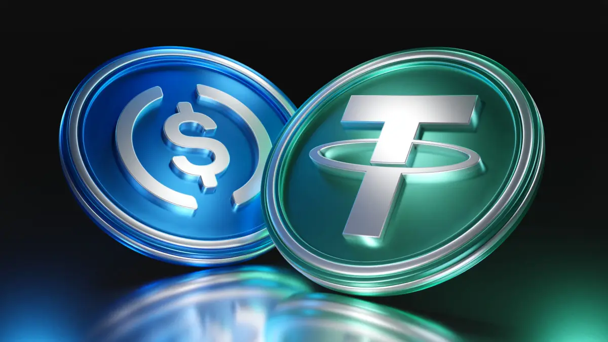 3D rendered coins featuring the USDC and Tether USDT logos side by side on a dark reflective surface