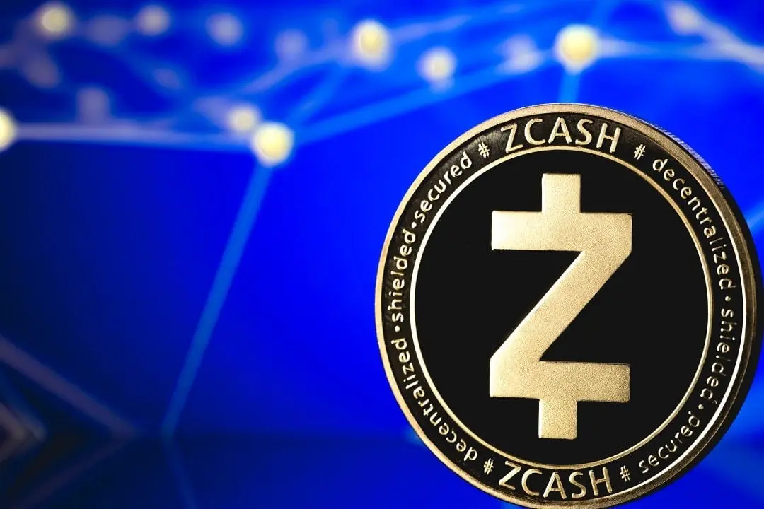 A close-up of a physical Zcash coin featuring its logo against a blurred blue digital network background